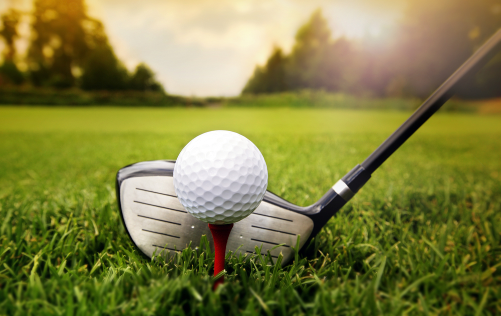 golf tee and club